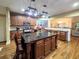 Beautiful kitchen features hardwood floors, granite counters, dark wood cabinets, and a center island at 4241 Hampton Mill Pkwy, Douglasville, GA 30135