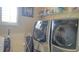 Functional laundry room with modern appliances, ample shelving, and a bright window at 4241 Hampton Mill Pkwy, Douglasville, GA 30135