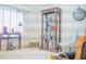 Elegant living room with a bookshelf, natural light, and comfortable seating at 4241 Hampton Mill Pkwy, Douglasville, GA 30135