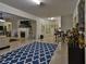 Open living room featuring a fireplace, shelving, tile flooring, bar seating, and lots of natural light at 4241 Hampton Mill Pkwy, Douglasville, GA 30135