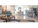 Bright living space featuring a dining area, breakfast bar, and tile flooring for a modern and functional design at 4241 Hampton Mill Pkwy, Douglasville, GA 30135