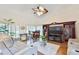 Bright living room with hardwood floors, vaulted ceiling, ceiling fan, and comfortable seating at 4241 Hampton Mill Pkwy, Douglasville, GA 30135