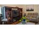 Relaxing living room with a large TV, comfortable seating, and refined decorations at 4241 Hampton Mill Pkwy, Douglasville, GA 30135