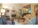 Inviting living room featuring a fireplace, comfortable seating, and seamless flow to the dining area for easy entertaining at 4241 Hampton Mill Pkwy, Douglasville, GA 30135