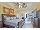 Large main bedroom with fan, carpet, crown molding, and furniture at 4241 Hampton Mill Pkwy, Douglasville, GA 30135