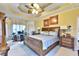A spacious main bedroom is decorated with carpet, crown molding, fan, and large windows at 4241 Hampton Mill Pkwy, Douglasville, GA 30135