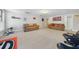 Spacious carpeted basement includes comfortable seating, tv viewing area, and natural light from the windows at 5585 Lavender Farms Rd, Powder Springs, GA 30127