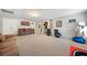 Large basement featuring neutral carpet, entertainment area, and extra spaces for recreation or storage at 5585 Lavender Farms Rd, Powder Springs, GA 30127