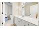 Powder room featuring single sink, vanity, and neutral wall color at 5585 Lavender Farms Rd, Powder Springs, GA 30127