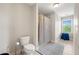 Bathroom featuring a single sink, vanity, toilet, shower with curtain, and tile flooring at 5585 Lavender Farms Rd, Powder Springs, GA 30127