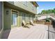 Outdoor living on this deck features built in BBQ, seating, and view of the private backyard at 5585 Lavender Farms Rd, Powder Springs, GA 30127