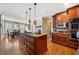Spacious kitchen features a center island, stainless appliances, and hardwood floors at 5585 Lavender Farms Rd, Powder Springs, GA 30127