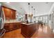 Bright kitchen with hardwood floors, granite countertops, and stainless steel appliances at 5585 Lavender Farms Rd, Powder Springs, GA 30127