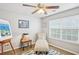 Cozy bedroom with a ceiling fan, daybed, and decorative artwork at 7710 Bucknell Terrace, Fairburn, GA 30213