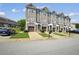Charming townhome showcases a stone and siding facade, inviting front entrance and attached garage at 7710 Bucknell Terrace, Fairburn, GA 30213