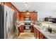 Well-equipped kitchen boasts stainless steel appliances, stylish countertops, and ample cabinet space at 7710 Bucknell Terrace, Fairburn, GA 30213