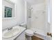 Clean bathroom with a standing shower, sleek vanity, and modern fixtures at 1596 Allgood Rd, Stone Mountain, GA 30083