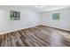 Bright and airy bedroom featuring large windows and sleek, modern flooring at 1596 Allgood Rd, Stone Mountain, GA 30083