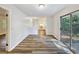 Open dining area with a sliding glass door and adjacent kitchen, perfect for gatherings at 1596 Allgood Rd, Stone Mountain, GA 30083