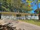 Charming single-story home featuring a spacious garage and a welcoming front porch at 1596 Allgood Rd, Stone Mountain, GA 30083