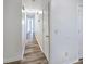 Hallway featuring modern flooring with neutral walls that connect to other rooms at 1596 Allgood Rd, Stone Mountain, GA 30083