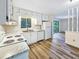 Well-lit kitchen featuring bright cabinets, modern appliances, and easy access to living area at 1596 Allgood Rd, Stone Mountain, GA 30083