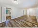 Open-concept living space with modern floors that connects to a bright, inviting kitchen at 1596 Allgood Rd, Stone Mountain, GA 30083
