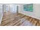 Bright living room featuring sleek flooring and natural light from a large window at 1596 Allgood Rd, Stone Mountain, GA 30083