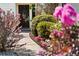 Landscaped walkway leading to the front door, surrounded by lush plantings and decorative features at 195 Pine Trail Rd, Fayetteville, GA 30214