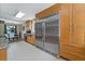 Modern kitchen with stainless steel appliances, custom cabinetry, and tile flooring at 195 Pine Trail Rd, Fayetteville, GA 30214