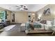 Serene main bedroom featuring hardwood floors, a ceiling fan, and a sitting area with lots of natural light at 195 Pine Trail Rd, Fayetteville, GA 30214