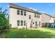 Backyard with a patio set, a grill and green grass at 2481 Southhaven Ln, Buford, GA 30519