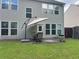 Backyard featuring a patio, grill, and a well-maintained lawn at 2481 Southhaven Ln, Buford, GA 30519