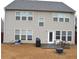 Spacious backyard featuring a dining set and firepit that is perfect for outdoor gatherings at 2481 Southhaven Ln, Buford, GA 30519
