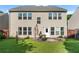 Backyard with a patio set, a grill and lush green grass at 2481 Southhaven Ln, Buford, GA 30519