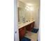 Bathroom with dual vanities and large mirror, offering a spacious feel at 2481 Southhaven Ln, Buford, GA 30519