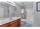 Bright bathroom features a sink with cabinets, toilet and shower-tub combination at 2481 Southhaven Ln, Buford, GA 30519
