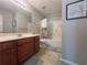 Full bathroom with double sink vanity, and shower-tub combo at 2481 Southhaven Ln, Buford, GA 30519