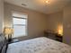 Cozy bedroom featuring a comfortable bed, a desk, and a bright window at 2481 Southhaven Ln, Buford, GA 30519