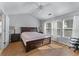 Spacious bedroom with vaulted ceiling, many windows, and wood-look flooring at 2481 Southhaven Ln, Buford, GA 30519