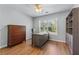 Home office with a wood desk, a wood dresser and a built-in bookshelf at 2481 Southhaven Ln, Buford, GA 30519