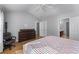 Cozy bedroom with ceiling fan, neutral walls, and attached bathroom at 2481 Southhaven Ln, Buford, GA 30519