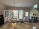 Light-filled dining area featuring a stylish table, chairs, and charming window coverings at 2481 Southhaven Ln, Buford, GA 30519
