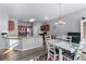 Eat-in kitchen featuring stainless steel appliances, granite countertops, and stylish adjacent dining area at 2481 Southhaven Ln, Buford, GA 30519
