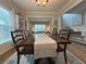 Charming dining room with a view into the living room, hardwood floors, and natural light at 2481 Southhaven Ln, Buford, GA 30519