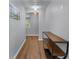 Hallway features wood flooring, neutral walls, and modern lighting at 2481 Southhaven Ln, Buford, GA 30519