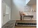 Stylish hallway with hardwood floors, decorative artwork, and a welcoming front door at 2481 Southhaven Ln, Buford, GA 30519