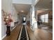 Inviting hallway featuring hardwood floors, elegant decor, and access to multiple rooms at 2481 Southhaven Ln, Buford, GA 30519