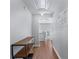 Hallway featuring hardwood floors, neutral paint, and decorative console table at 2481 Southhaven Ln, Buford, GA 30519