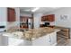 Spacious kitchen with granite countertops, stainless steel appliances, and a view of the breakfast area at 2481 Southhaven Ln, Buford, GA 30519